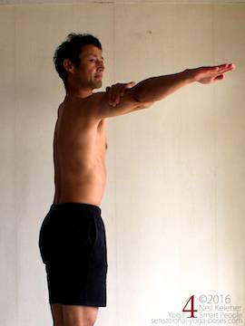Arm to the side active shoulder stretch, pulling one arm back while holding on to upper arm with other hand, neil keleher, sensational yoga poses.