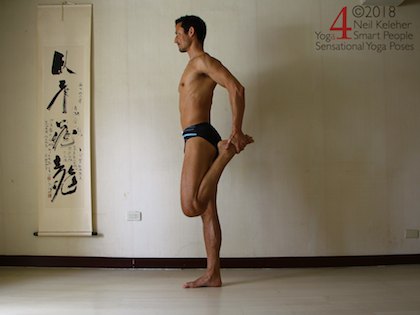 Quad stretch standing balance pose. Neil Keleher. Sensational Yoga Poses.
