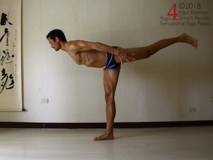 Warrior 3 standing balance pose with arms reaching back, hip over heel. Neil Keleher. Sensational Yoga Poses.