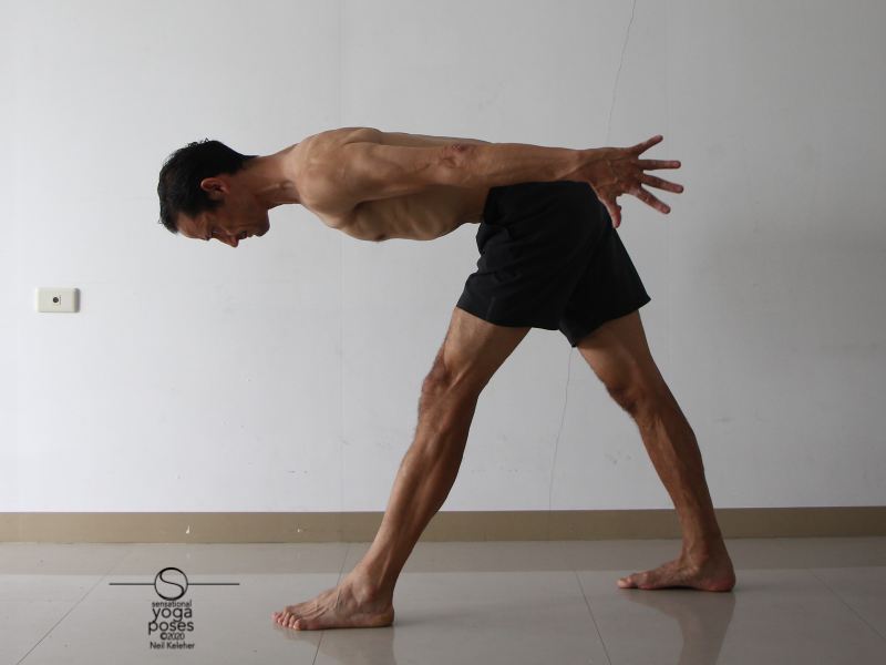 Pyramid pose with hamstrings activated prior to lifting hands and reaching them back.