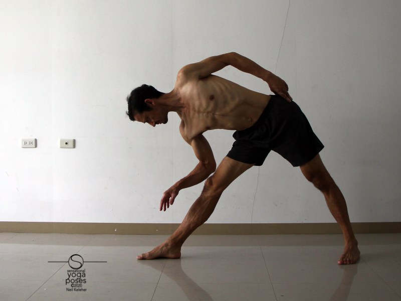 triangle pose hamstring stretch with bottom hand lifted. Neil Keleher, Sensational Yoga Poses.