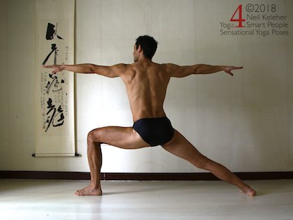 Warrior 2 standing yoga pose with shoulder blades protracted (spread apart). Neil Keleher. Sensational Yoga Poses.