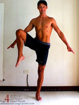 yoga tree pose preparation exercise, standing on one leg with the other leg lifted to the side. Knee and hip on lifted leg side are both lifted high. Neil Keleher. Sensational Yoga Poses.